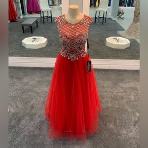 Size 4. red. a line ballgown. sequin. beaded. tulle bottom. keyhole back